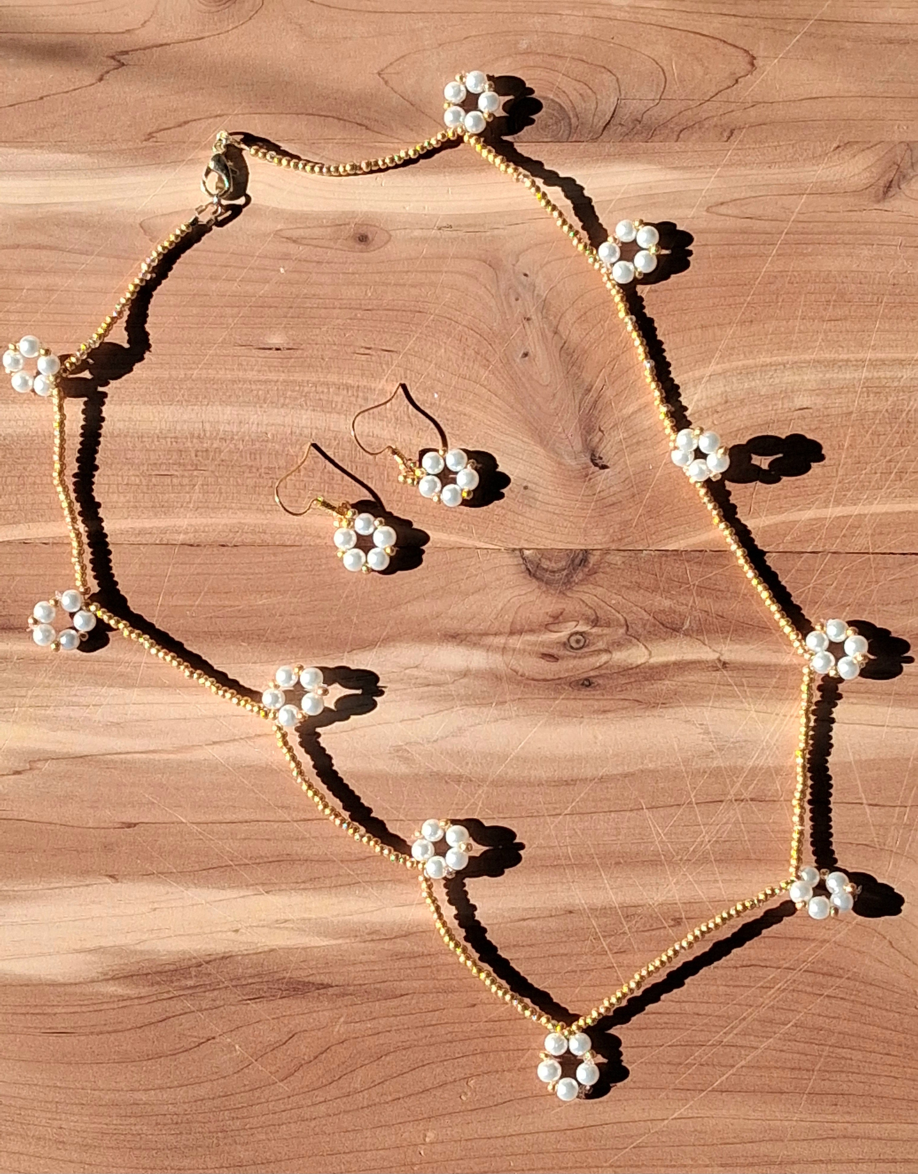 Gold and white pearl necklace and earring set