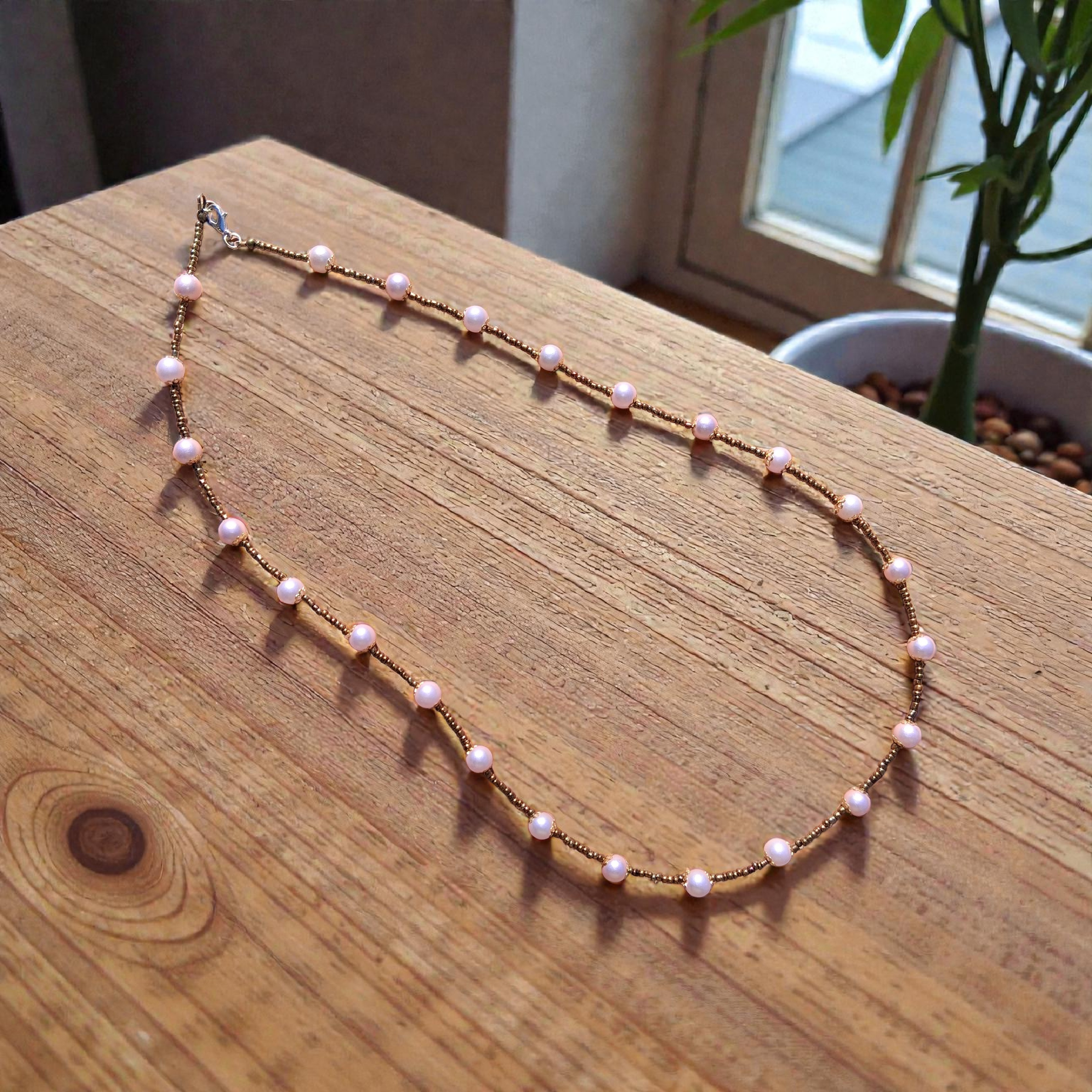 boho bronze necklace with light pink pearls